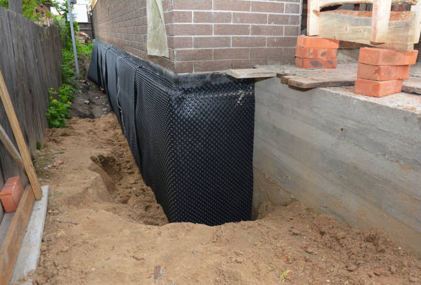 Happy homeowners after waterproofing job in Cedarburg